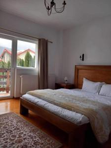 En eller flere senge i et værelse på Vila Miro Monte