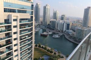 a view of a river in a city with tall buildings at Bellehomez in Dubai