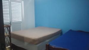 Postel nebo postele na pokoji v ubytování Casa PRAIA c piscina Balneário Santa Teresinha + 17 fotografií