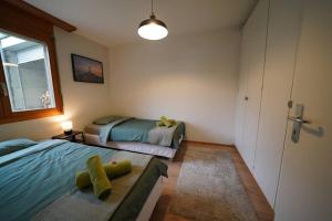 Postel nebo postele na pokoji v ubytování Sonniges Haus bei Bern