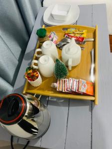 a table with two trays with items on it at AfrikaWisa at O.R. Tambo International Airport in Kempton Park