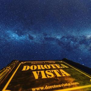 a drowsy wish sign on the side of a building under a star filled at Dorotea Vista in Puerto Natales