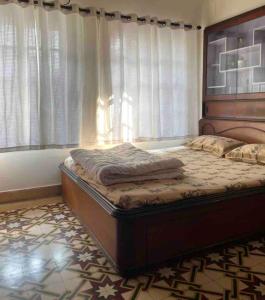 מיטה או מיטות בחדר ב-Green Intimate House