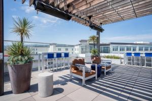 a patio with two chairs and a table on a roof at Redwood City 2BR w WD Pool BBQ nr Caltrain SFO-505 in Redwood City