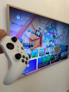 TV a/nebo společenská místnost v ubytování IMPERIAL Apartments