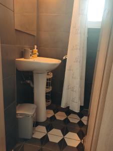 a bathroom with a sink and a toilet and a shower at KASTRO HOUSE in Skopelos Town +97 photos