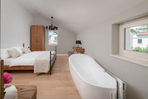 Letto o letti in una camera di Villa Basca