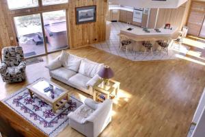 an aerial view of a living room and kitchen at Lakefront Estate W/Stunning Views in Big Bear Lake in Big Bear Lake