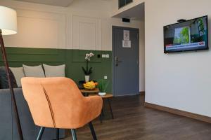 TV a/nebo společenská místnost v ubytování Hotel Dijana