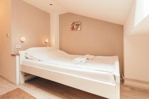 Postel nebo postele na pokoji v ubytování Hotel Dijana