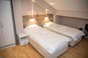 Postel nebo postele na pokoji v ubytování Hotel Dijana