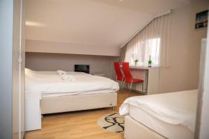 Postel nebo postele na pokoji v ubytování Hotel Dijana