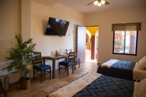 a living room with a table and a dining room at Estancia 105 in La Paz
