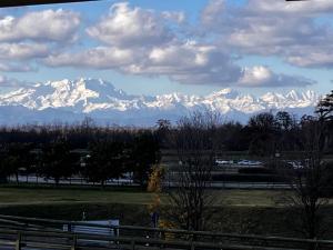 a view of a snow covered mountain range at A&A Rooftop in Somma Lombardo