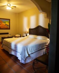 Ліжко або ліжка в номері Hotel Plaza Yat Balam
