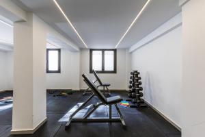 an empty room with two chairs in the middle at Varkiza Luxury Suites by Raise in Vari