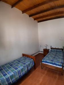Postel nebo postele na pokoji v ubytování Santo Cura Brochero zona centro