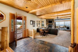 a living room and dining room with a view of the ocean at 59 - Lakeview Lodge home in Big Bear Lake