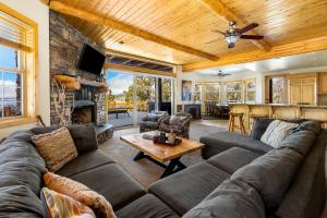 a living room with a couch and a table at 59 - Lakeview Lodge home in Big Bear Lake