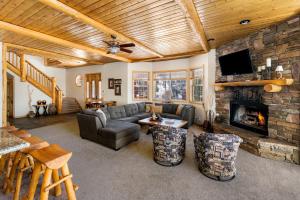 a living room with a couch and a fireplace at 59 - Lakeview Lodge home in Big Bear Lake