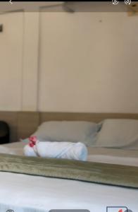 En eller flere senge i et værelse på Piaui Apart Hotel