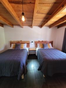 Postel nebo postele na pokoji v ubytování Meson del Bosque