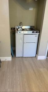 a small kitchen with a sink in a room at Charming Lakeview Retreat II only 5 Min Sea World in Orlando