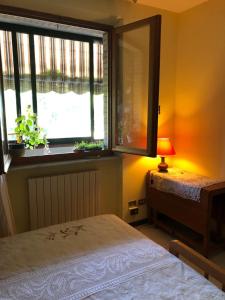 A bed or beds in a room at IL NIDO DI RONDINE Még 37 kép