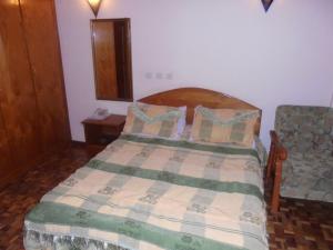 En eller flere senge i et værelse på Weygoss Guest House