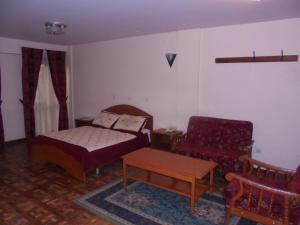 מיטה או מיטות בחדר ב-Weygoss Guest House