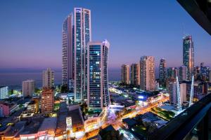 a city skyline at night with tall buildings at Ocean View Apartments - Self Contained & Privately Managed in Gold Coast