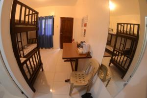 a view of a hallway with a room with bunk beds at Isla Water Sports and Resorts Inc in Batangas City