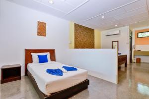 Postel nebo postele na pokoji v ubytování Aonang Privacy Resort