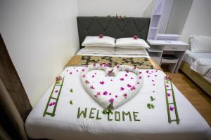 Letto o letti in una camera di iHaven Thulusdhoo
