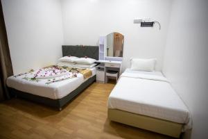 Letto o letti in una camera di iHaven Thulusdhoo