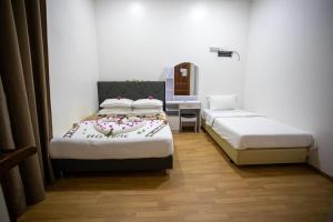 Letto o letti in una camera di iHaven Thulusdhoo