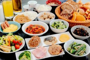 a table topped with bowls of different types of food at Kiso Mikawaya in Kiso