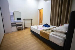 Letto o letti in una camera di iHaven Thulusdhoo