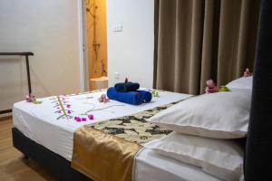 Letto o letti in una camera di iHaven Thulusdhoo