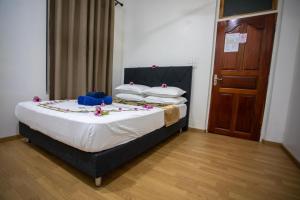 Letto o letti in una camera di iHaven Thulusdhoo
