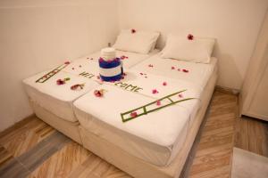 Letto o letti in una camera di iHaven Thulusdhoo