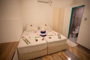 Letto o letti in una camera di iHaven Thulusdhoo