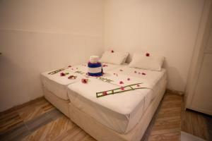 Letto o letti in una camera di iHaven Thulusdhoo