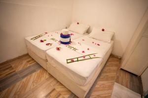 Letto o letti in una camera di iHaven Thulusdhoo
