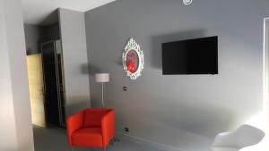 TV in/ali zabaviščno središče v nastanitvi Dans les Vignes
