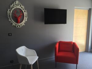 TV in/ali zabaviščno središče v nastanitvi Dans les Vignes