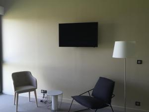 TV in/ali zabaviščno središče v nastanitvi Dans les Vignes