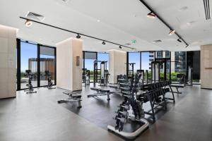 a gym with treadmills and chairs in a building at Luxury 3 Bed 2 Bath + car park at Melbourne Square in Melbourne