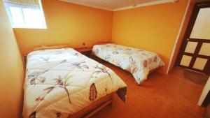Llit o llits en una habitació de ENEDE HOSTEL