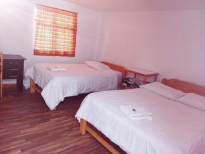 Llit o llits en una habitació de ENEDE HOSTEL